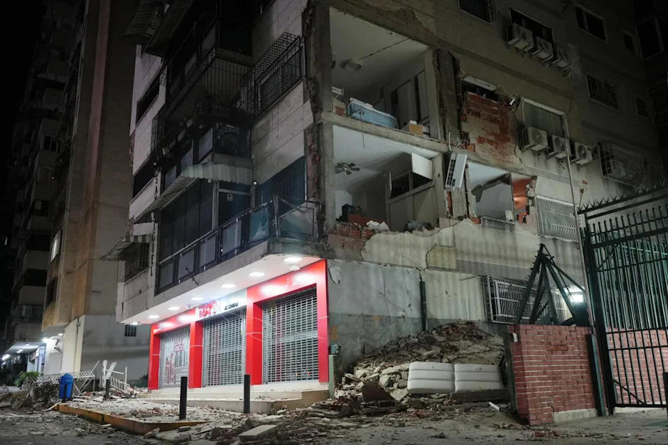 The interiors of buildings were visible after walls tumbled during the disaster.