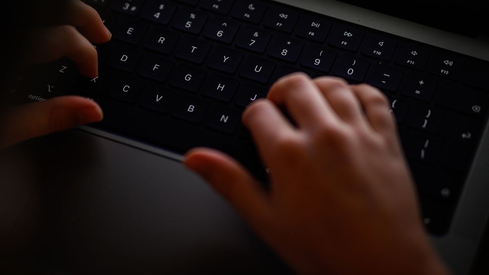LONDON, ENGLAND - JANUARY 17: In this photo illustration, a teenage child looks at a screen of age-restricted content on a laptop screen on January 17, 2023 in London, England. The Bill aims to protect young and vulnerable viewers by introducing new rules for social media companies which host user-generated content, and for search engines, which will have tailored duties focussed on minimising the presentation of harmful search results. Content that platforms will need to remove includes child sexual abuse material, revenge pornography, selling illegal drugs or weapons, and terrorism. (Photo by Leon Neal/Getty Images)
