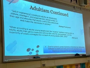 A presentation slide titled “Adultism Continued” defining adult supremacy and discussing power dynamics between students and educators. SFUSD