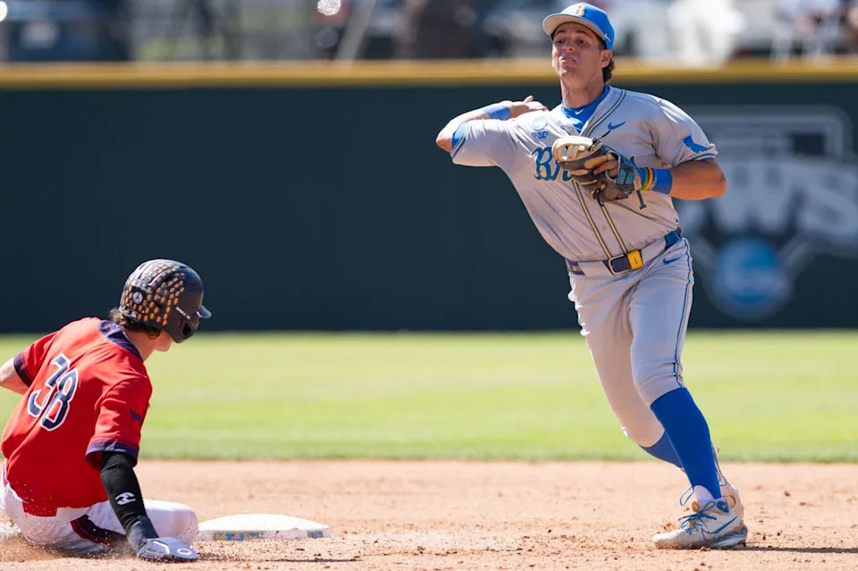 UCLA Bruins shortstop Roch Cholowsky (1) throws the ball to first base for a double play during an NCAA regional championship elimination game between the Saint Mary's College Gaels and UCLA Bruins on May 31, 2026 at Jackie Robinson Stadium in Los Angeles Calif.