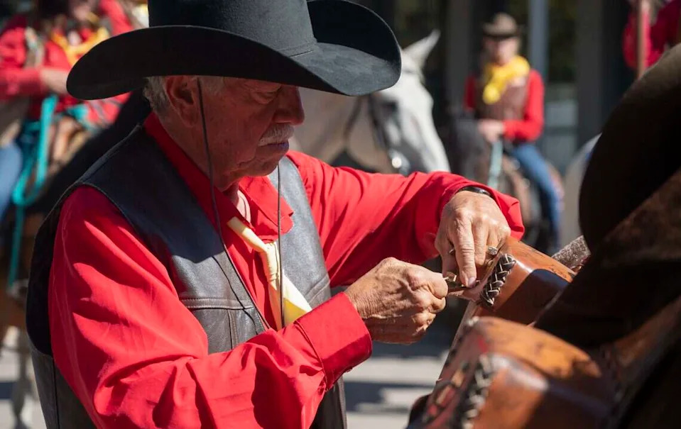 Fred Leslie, president of the National Pony Express Association, unlocks a cantina on a saddle to reveal mail that was carried during the riders ten-day trip across the United States in Old Sacramento on Thursday, June 25, 2026. The riders reenact the ride every year in celebration of the historical Pony Express.