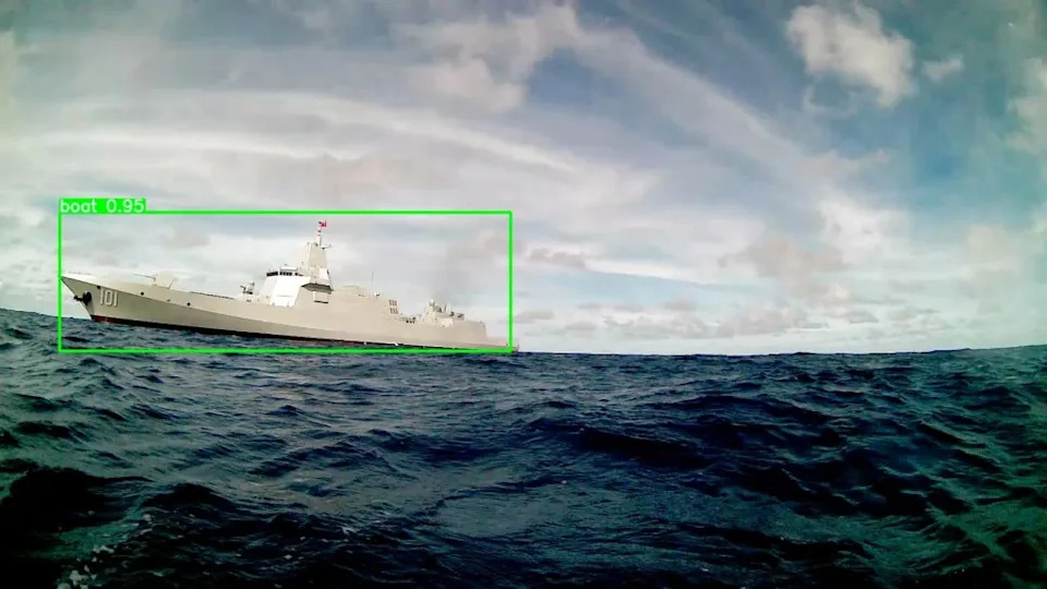 The Seasats’ Lightfish autonomous surface vessel sails near the Chinese destroyer CNS Nanchang. Seasats