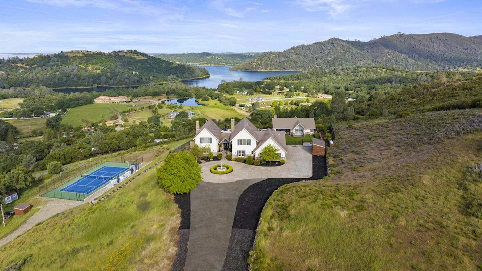 A hilltop estate at 2001 Salmon Valley Lane in El Dorado Hills looks out over Folsom Lake and the surrounding valleys. The 5-bedroom home sold March 31 for $2.35 million.
