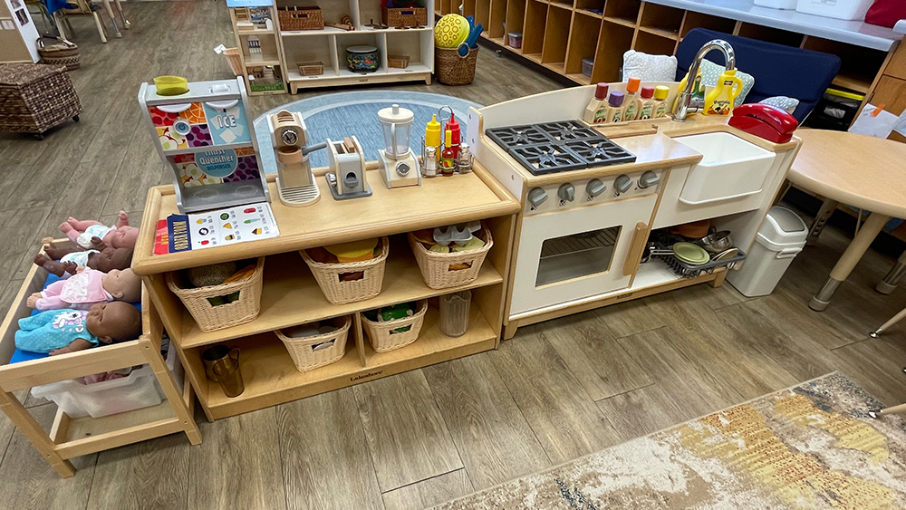 large kitchen themed play area in a CDC classroom
