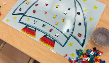 game with a rocketship and movable alphabet letters