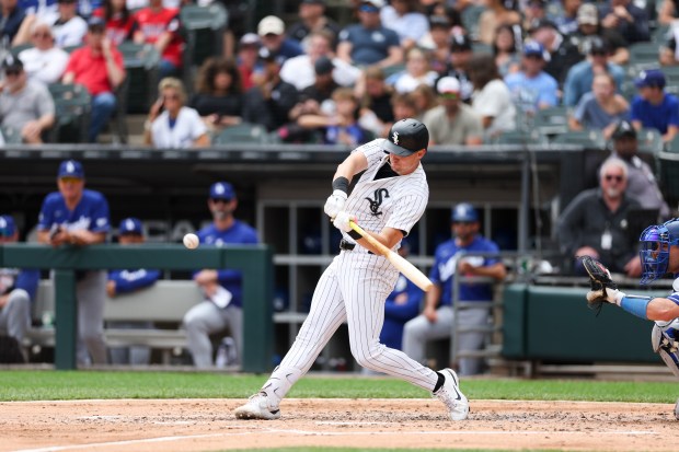 White Sox shortstop Colson Montgomery (12) hits a double during the fourth inning against the Dodgers at Rate Field June 14, 2026 in Chicago. (Armando L. Sanchez/Chicago Tribune)
