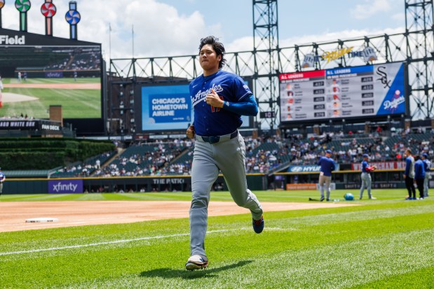Dodgers two-way player Shohei Ohtani (17) warms up on the field before the Dodgers play the White Sox at Rate Field Sunday June 14, 2026 in Chicago. (Armando L. Sanchez/Chicago Tribune)
