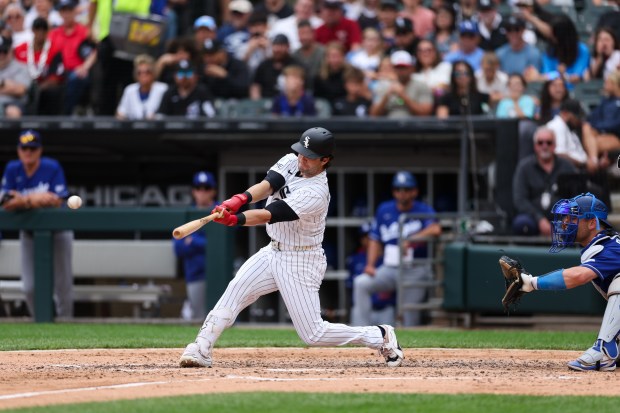 White Sox designated hitter Andrew Benintendi (23) hits a RBI double during the sixth inning against the Dodgers at Rate Field June 14, 2026 in Chicago. (Armando L. Sanchez/Chicago Tribune)