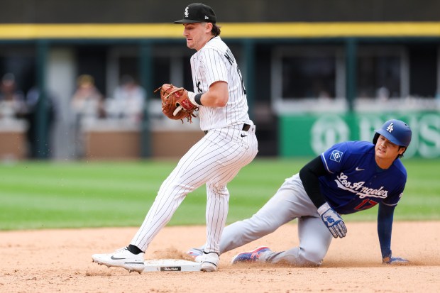 White Sox shortstop Colson Montgomery (12) tags out Dodgers two-way player Shohei Ohtani (17) at second base during the ninth inning at Rate Field June 14, 2026 in Chicago. (Armando L. Sanchez/Chicago Tribune)