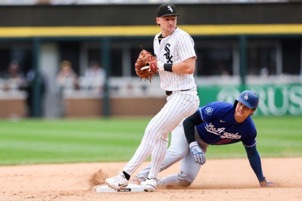 White Sox shortstop Colson Montgomery (12) tags out Dodgers two-way player Shohei Ohtani (17) at second base during the ninth inning at Rate Field June 14, 2026 in Chicago. (Armando L. Sanchez/Chicago Tribune)