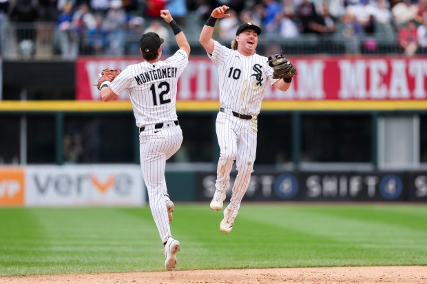 White Sox shortstop Colson Montgomery (12) celebrates with White Sox second baseman Chase Meidroth (10) after the White Sox defeated the Dodgers, 4-6, at Rate Field June 14, 2026 in Chicago. (Armando L. Sanchez/Chicago Tribune)
