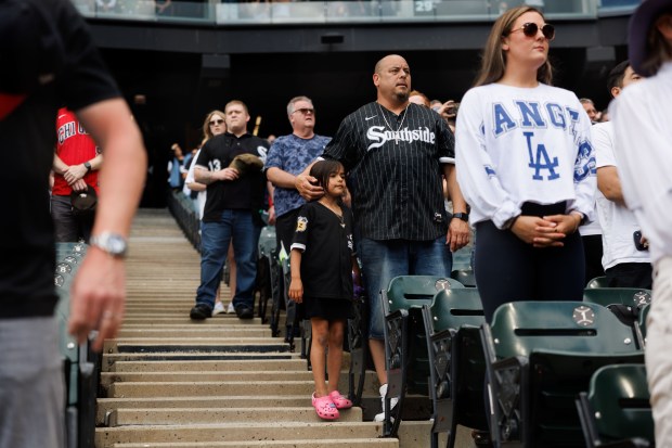 People stand during "God Bless America" before the White Sox play the Dodgers at Rate Field Sunday June 14, 2026 in Chicago. (Armando L. Sanchez/Chicago Tribune)