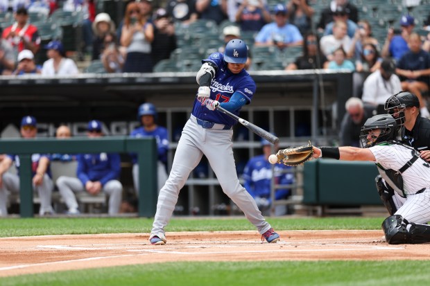White Sox catcher Drew Romo (36) interferes with Dodgers two-way player Shohei Ohtani (17) allowing him to reach first during the first inning at Rate Field Sunday June 14, 2026 in Chicago. (Armando L. Sanchez/Chicago Tribune)