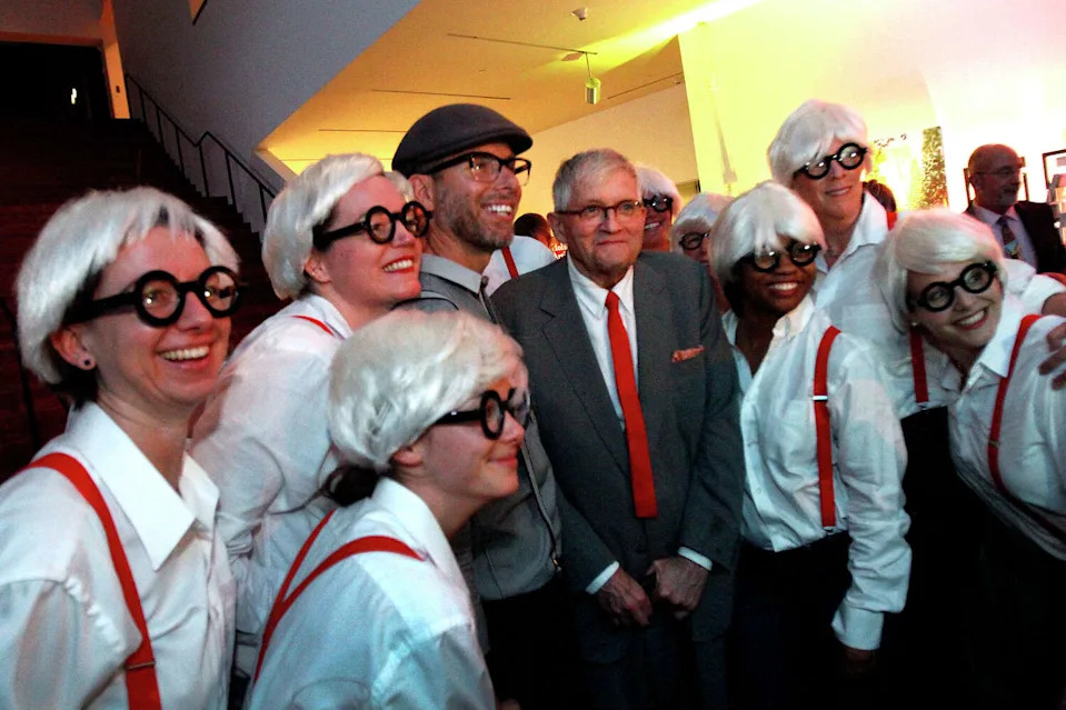 The artist David Hockney poses for a photograph with a group dressed like him at the de Young Museum in San Francisco, Calif., on Thursday, October 24, 2013. (Sarah Rice/Special to The Chronicle)