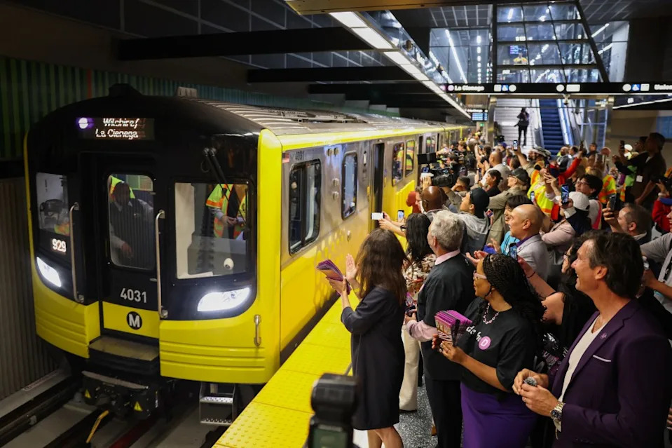 One of the first trains open to the public arrives to the Wilshire/Fairfax station on May 8, 2026, at the opening of the Metro D Line subway extension in Los Angeles.
