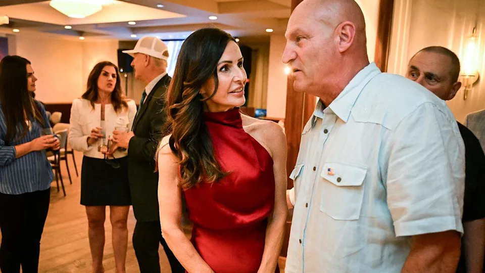 Jennifer Hamilton, center, who is running for Fresno County Superior Court Judge talks with former State Center Trustee Richard Caglia during an election night watch party at The Red Room in Fresno on Tuesday, June 2, 2026.