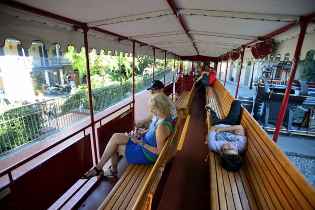 People relax on the shade covered Disneyland Railroad at Disneyland in Anaheim, California.(Photo by Jeff Gritchen, Orange County Register/SCNG)