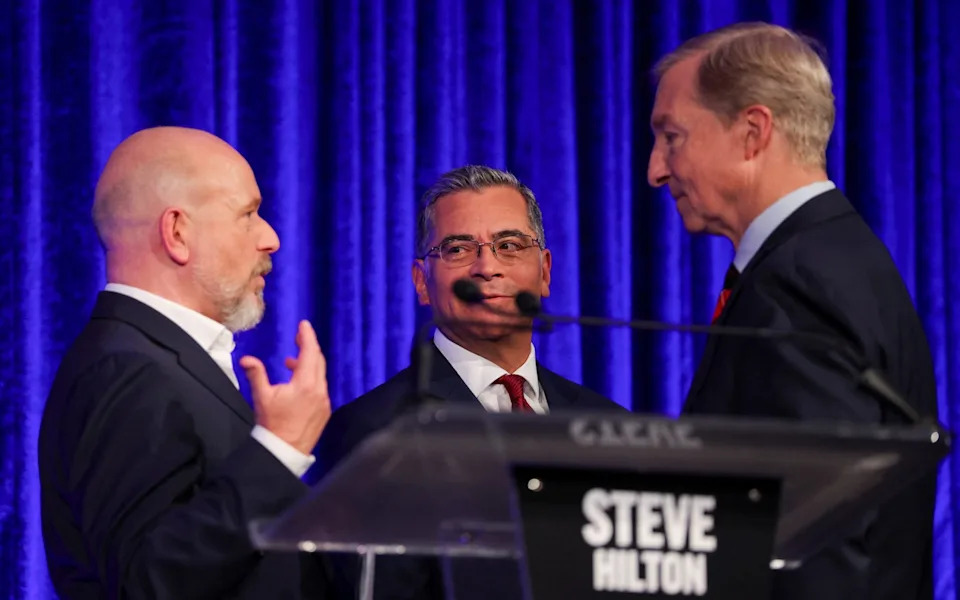 Mr Hilton, Xavier Becerra and Tom Steyer at a debate hosted by the San Francisco Examiner and CBS