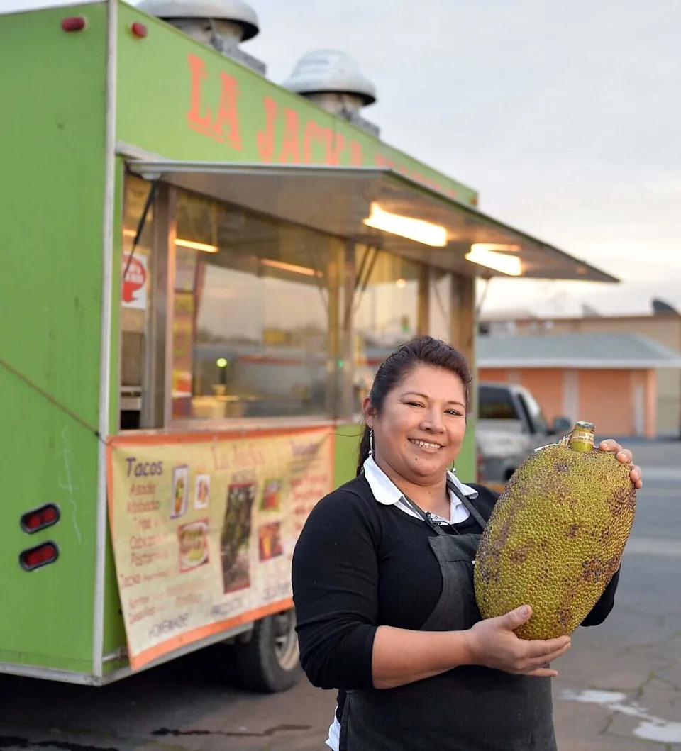La Jacka Mobile food truck owner/cook Miriam Martinez holds a jackfruit on Friday, Jan. 6, 2017, in Fresno. Martinez creates meatless dishes using the versatile jackfruit including tacos, burritos, quesadillas, and pulled “pork” sandwiches.