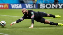 Tim Howard stretches to make a save.