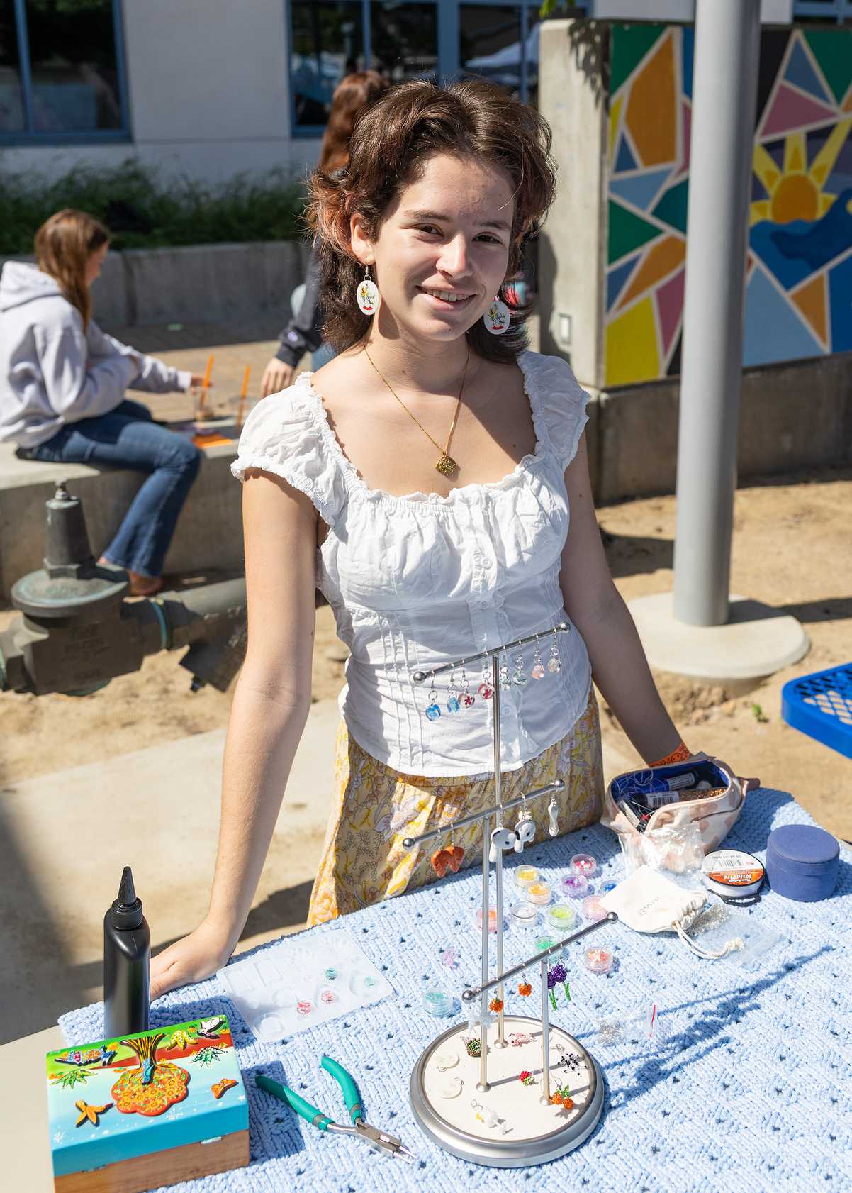 Anya Rocha displays her handmade jewelry (Jon Clark)