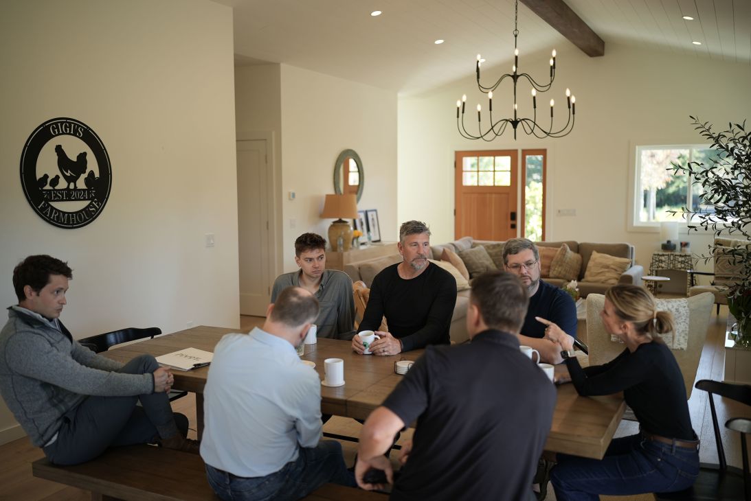 Rob Picheta, third from left at the end of the table, listens as Lori Jean Glass leads a group discussion.