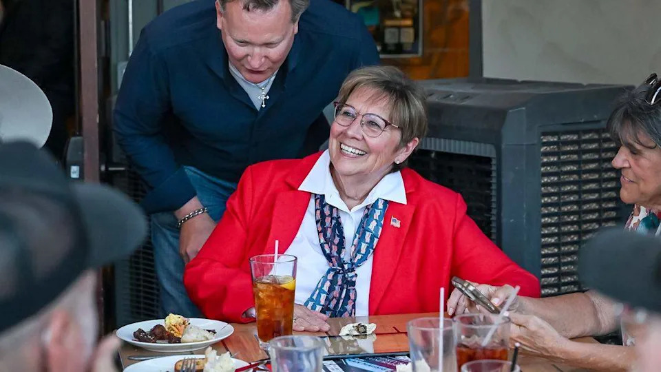 Margaret Mims, who is running for the Fresno County Board of Supervisors, District 4, smiles after hearing election results while talking with supporters including Andreas Borgeas, a former member of the State Senate and Fresno County Board of Supervisors during a election night watch party at The Elbow Room in Fresno on Tuesday, June 2, 2026.