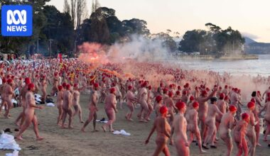 Nude swimmers take chilly plunge in Dark Mofo solstice swim