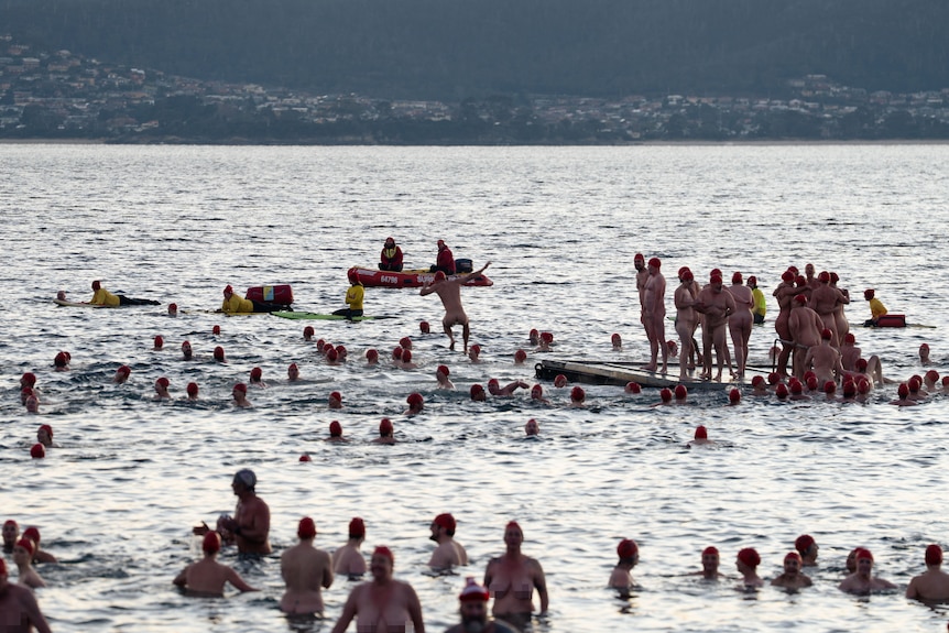 Naked swimmers in the River Derwent water celebrate the end of the longest night of the year for Nude Solstice Swim