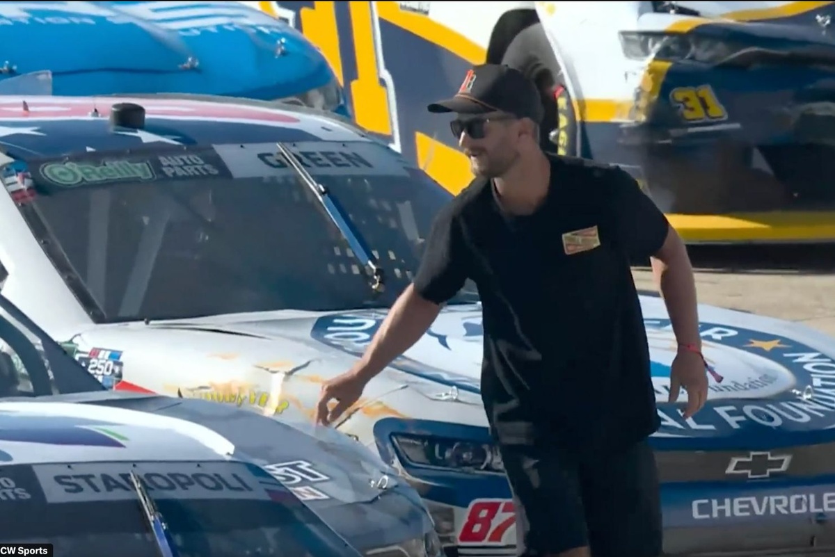 Fan arrested after scaling fences onto NASCAR track, fist-bumping driver during stoppage