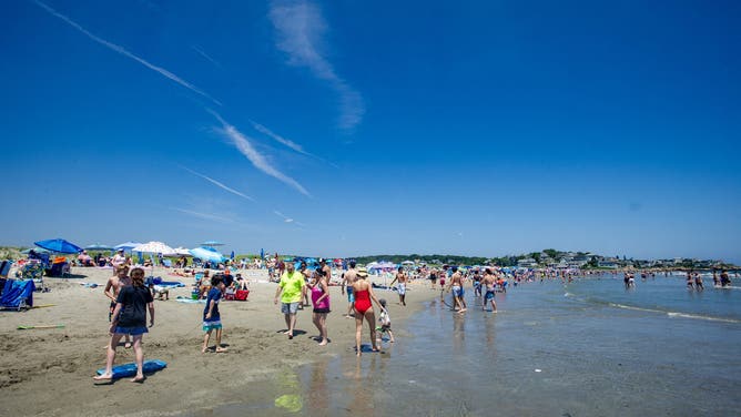 People pack the the sand and spaces were limited at Good Harbor Beach in Gloucester, Massachusetts on July 7, 2023.