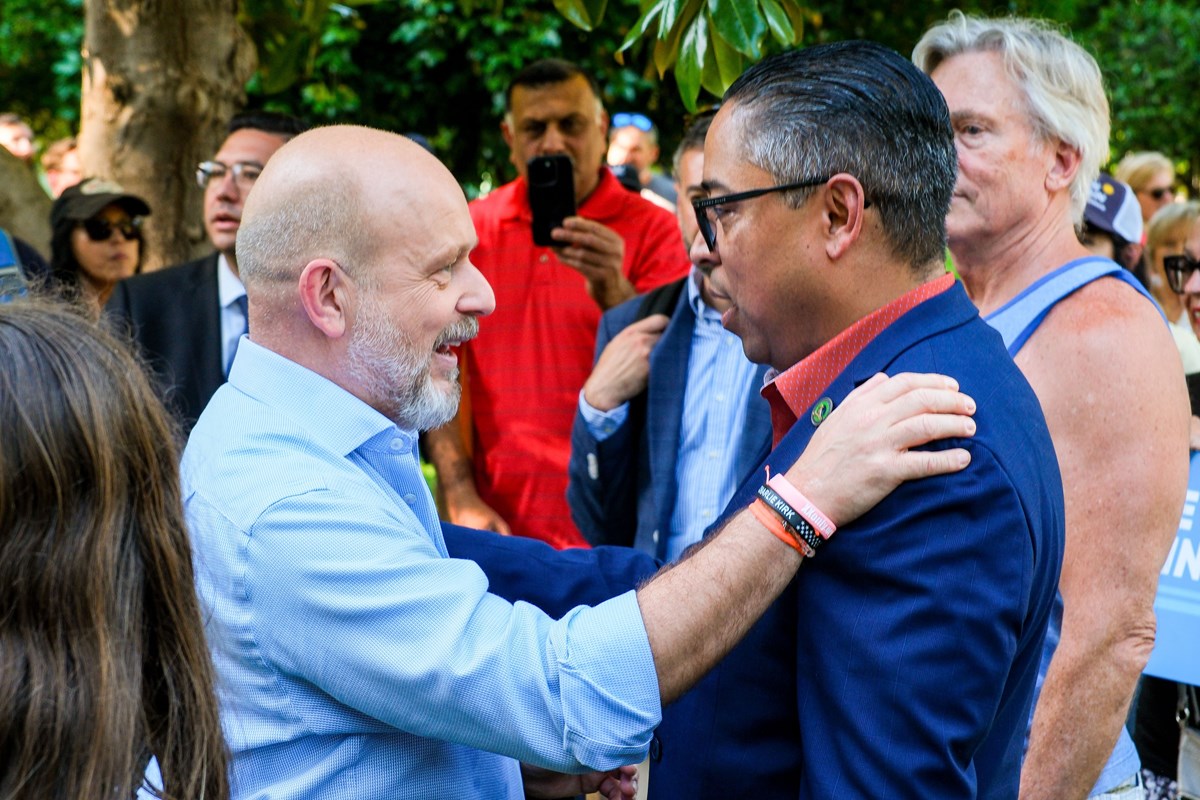 Steve Hilton embraces Jeff Gonzalez at the rally held at the Capitol on Wednesday, June 3, 2026.