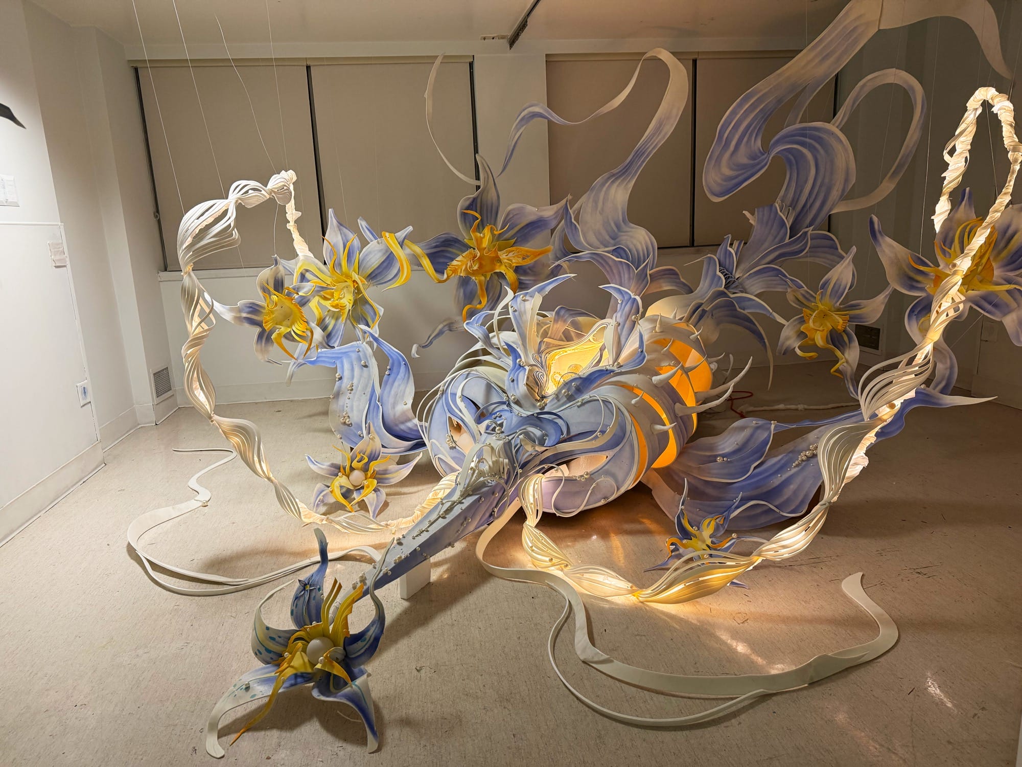 a hospital room installation transformed with a lustrous swirling light sculpture