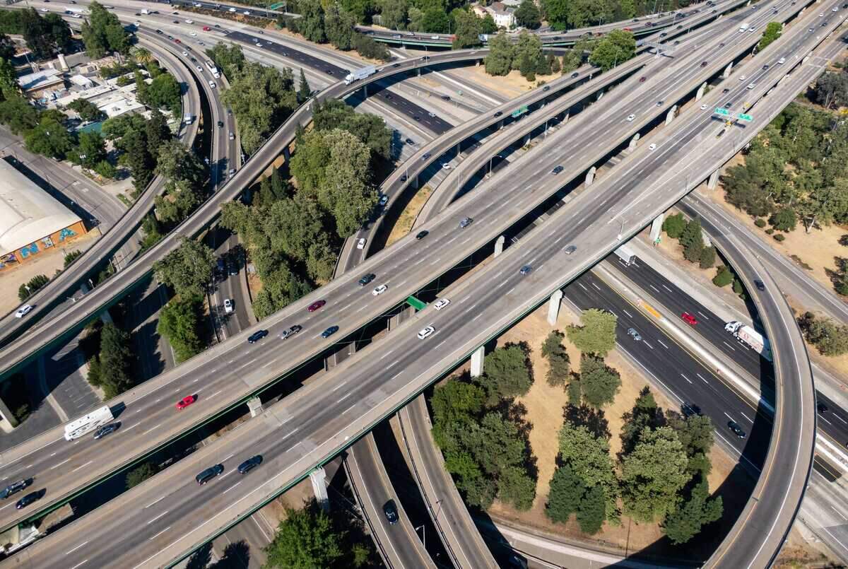 Vehicles travel through the Interstate 5 interchange in downtown Sacramento during evening commute hours in July 2021. Sacramento Mayor Kevin McCarty said the city is discussing possible parking discounts and expanded park and ride options to help accommodate thousands of state employees returning to offices four days a week.