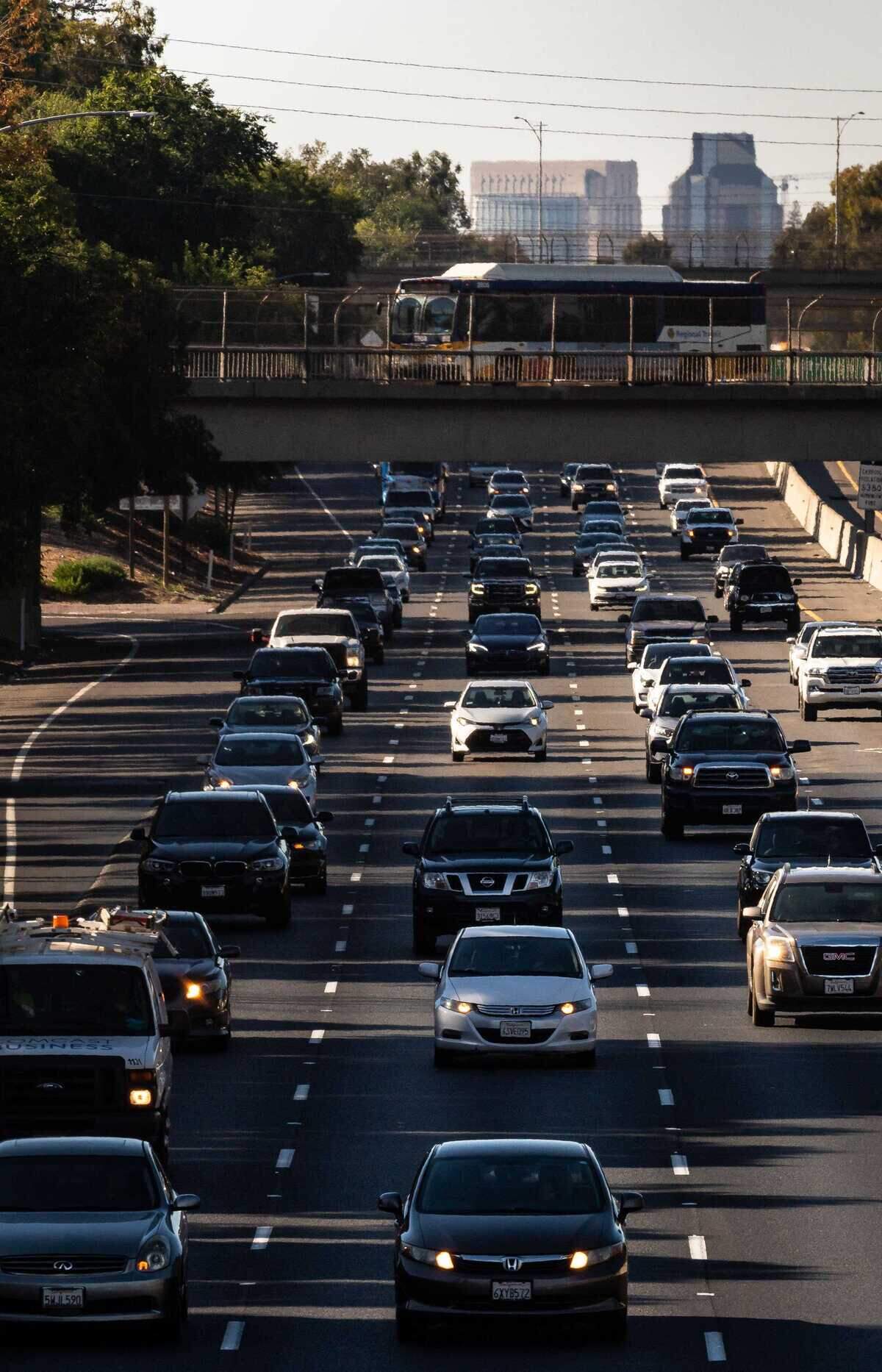 A steady stream of vehicles moves southbound on Highway 99 through south Sacramento during evening commute hours in July 2021. UC Davis transportation researcher Susan Handy expects more vehicles on Sacramento roads as state employees increase their required in office days from two to four each week, though she does not expect driving to double.
