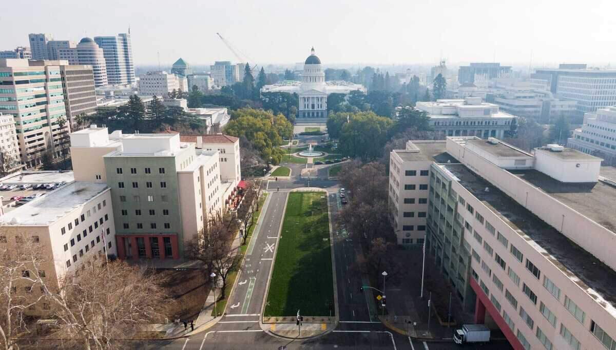 State office buildings flank Capitol Mall in January. Thousands of state employees are returning to Sacramento offices four days a week under Gov. Gavin Newsom's return to office order, increasing commuting to state office buildings throughout the capital region.