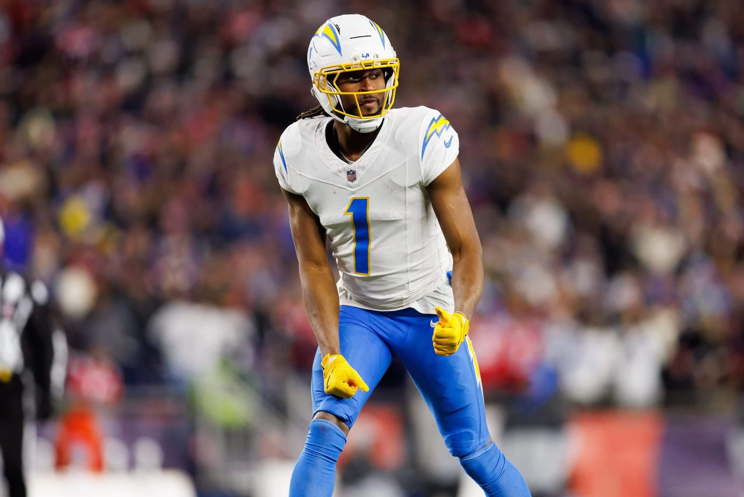 Quentin Johnston of the Los Angeles Chargers gets set during the NFL wild card playoff football game against the New England Patriots at Gillette Stadium on January 11, 2026 in Foxborough, Massachusetts
