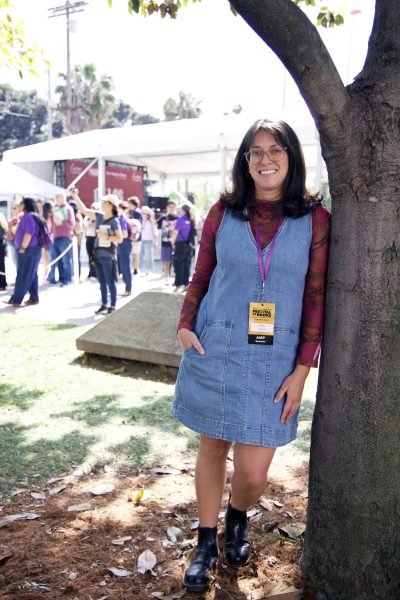 Los Angeles Times reporter Karen Garcia, 33, leans on a tree near the De Los Stage where she moderated the panel, 