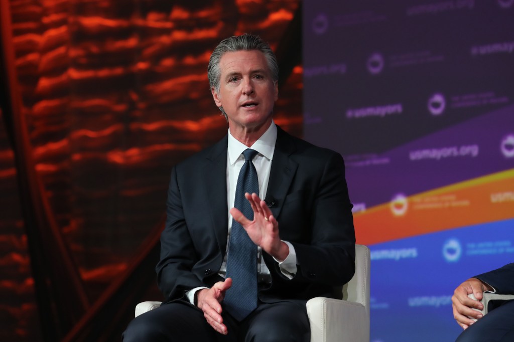 California Governor Gavin Newsom speaking at the U.S. Conference of Mayors' 94th Annual Meeting.