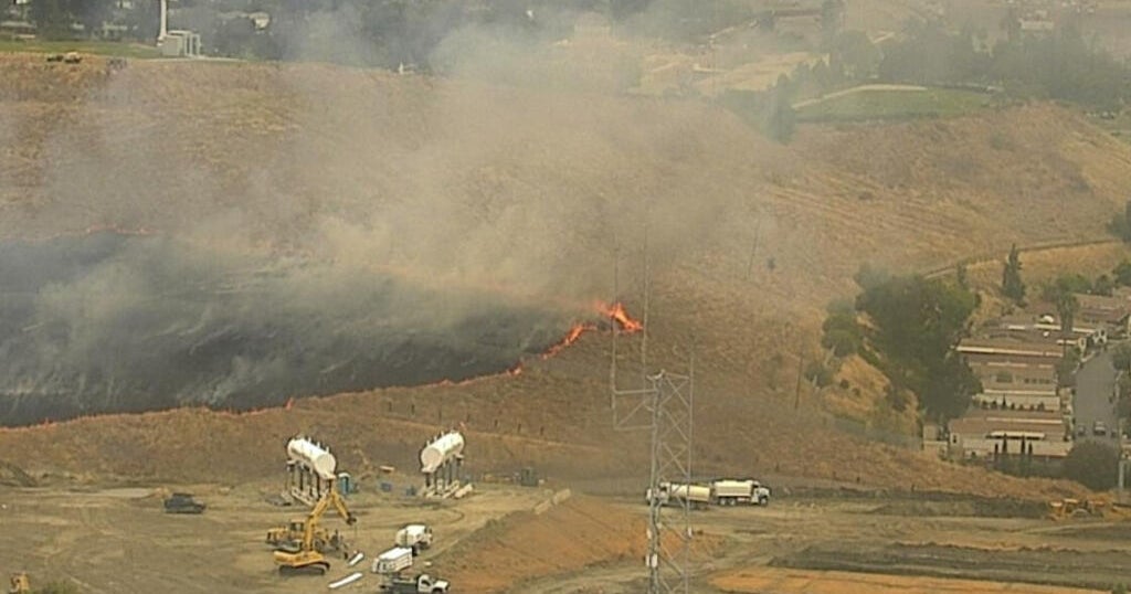 San Jose brush fire burns near homes before progress stopped