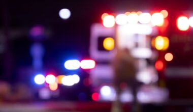 Blurred night image of first responders at the scene of an emergency