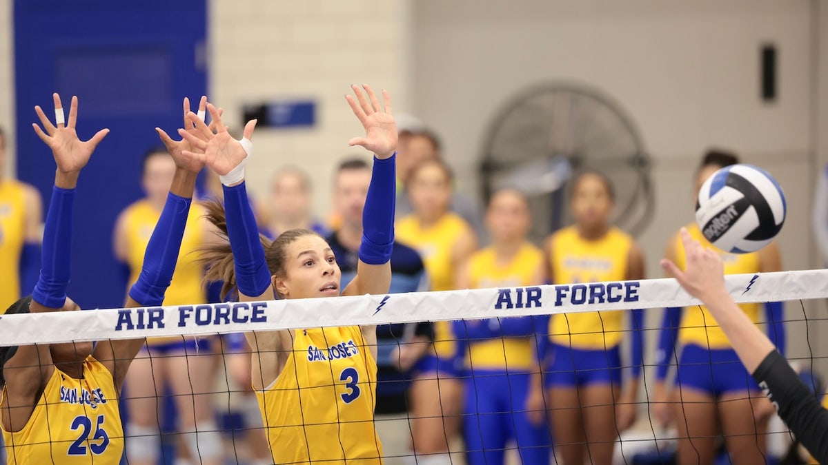 Blaire Fleming of San Jose State Spartans attempts to block a volleyball shot at Falcon Court.