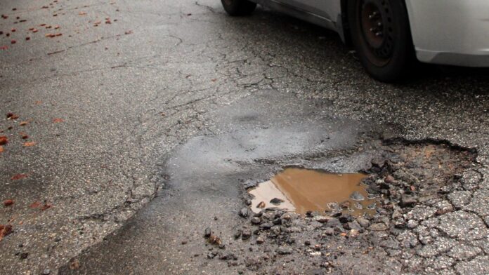 PHOTO: Henk Friezer | The South Pasadenan | A pothole on Monterey and Marengo in South Pasadena.