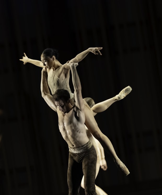 Dancers Isabella Seo, top, and Chandler Proctor rehearse Reka Gyulai Garcia's "Transcendence," which will be presented in Pointeworks' "Nocturnes: 5 Ballets" on Saturday, June 13, in La Jolla. (Hannah Cox)