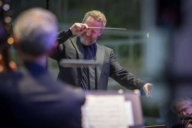 Michael Francis, artistic director of the Mainly Mozart All-Star Orchestra Festival, conducts a concert at the 2025 festival, which returns Wednesday for six La Jolla concerts. (J. Kat Photo)