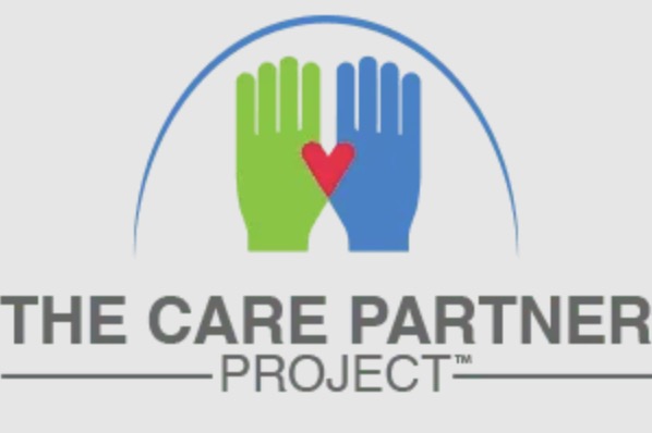 Illustration of THE CARE PROJECT logo with two hands, one green and one blue, meeting in the middle with a red heart.