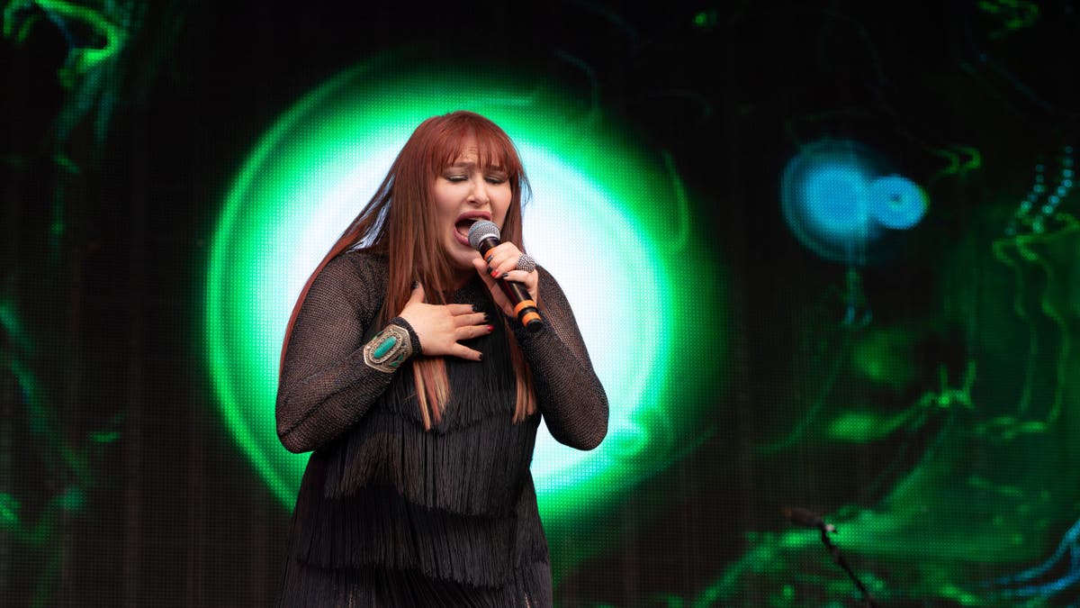 Tiffany performing on stage at Rewind Festival South in Henley-on-Thames, England
