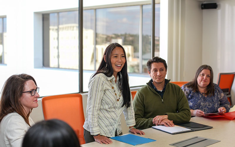 A team meets in a conference room.