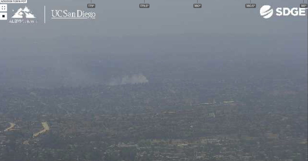 Brush fire threatens Bay Terraces homes