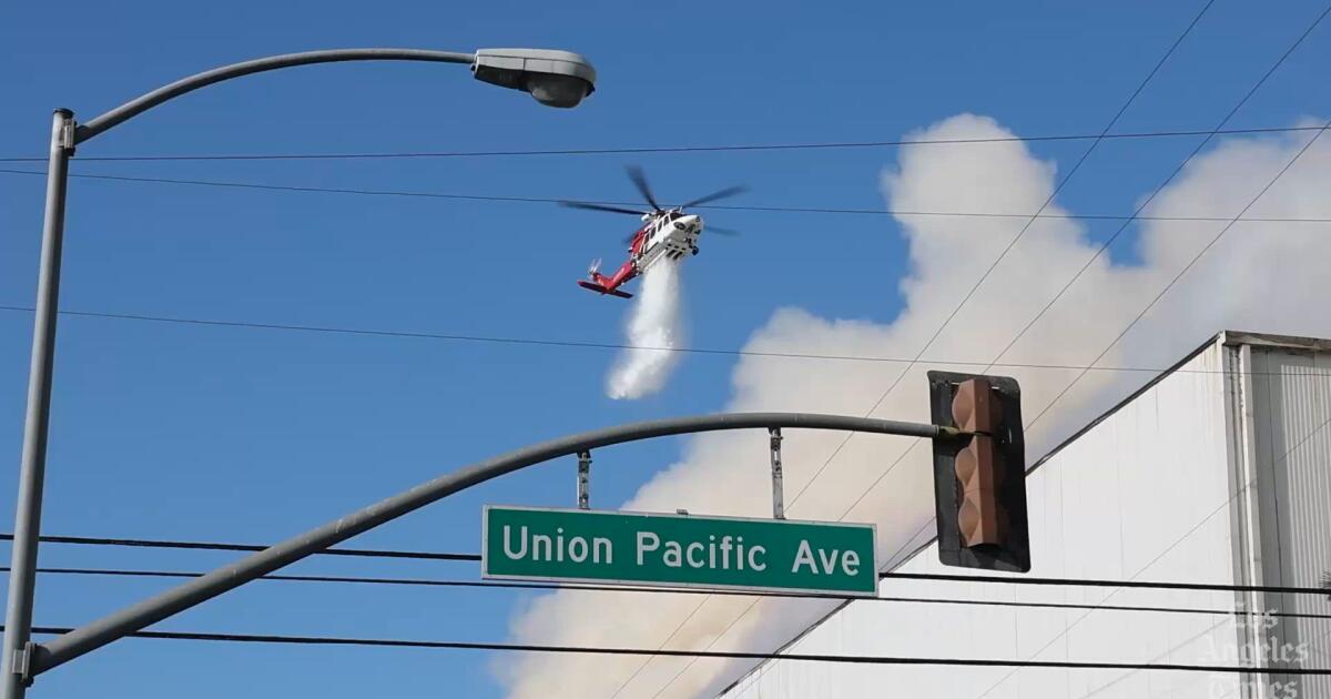 Boyle Heights fire continues spewing caustic smoke across region